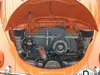 Engine bay of an orange VW Beetle